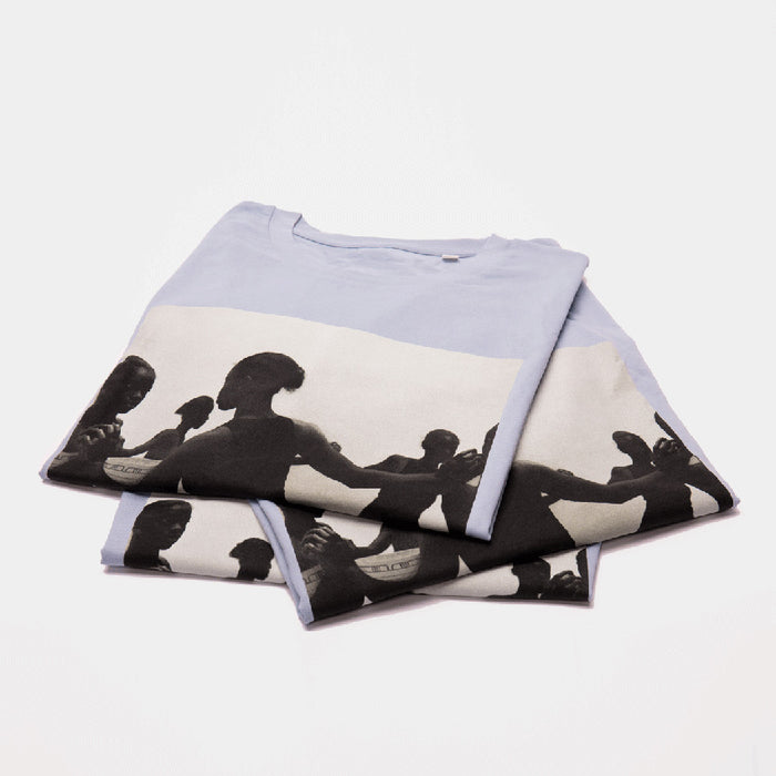 pile of 3 folded t-shirts with printed artwork